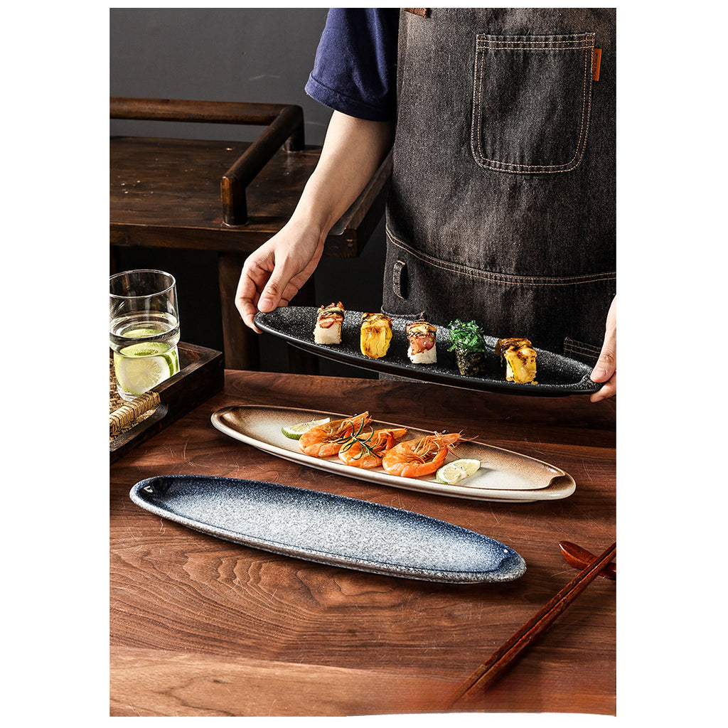 A Creatively Designed Large Oval Plate for Sushi, Sashimi, And Egg Dishes, Perfect for Restaurant Presentations And Wine Business Events